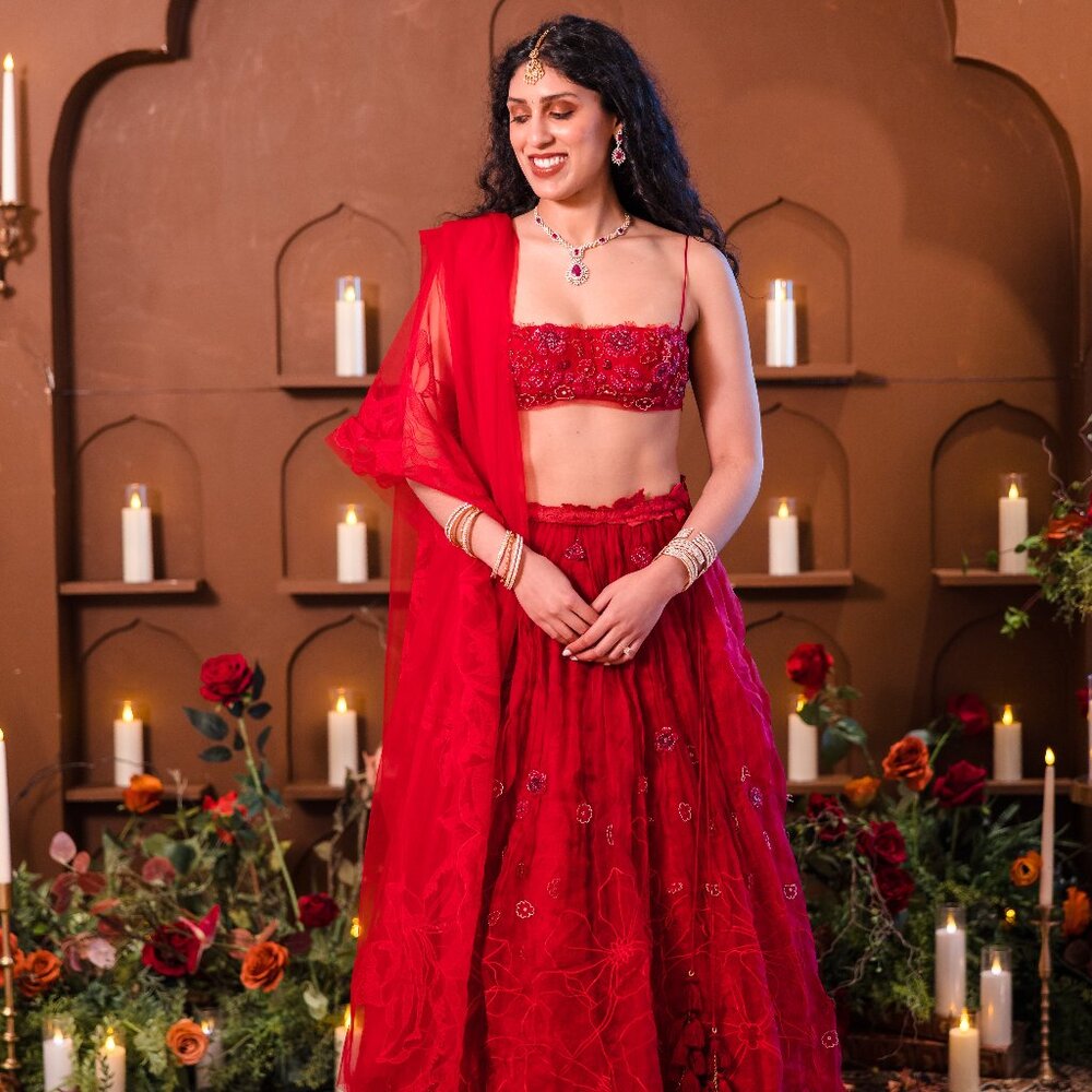 Little Black Bow A White Wedding lehenga in Red